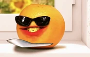 Orange with his sunglasses on.