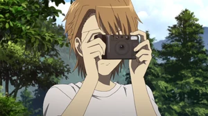 Naoya tomando la foto del grupo.