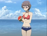 Takako doesn't like watermelon seeds. Here she can be seen dutifully sprinkling them in the sand.