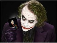 Heath Ledger's version of the Joker holding a card of Jack Nicholson's version of the Joker