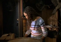 Nicki checks the trunk in the attic for more clue to help Emily