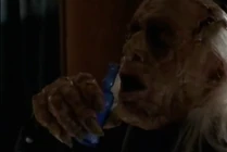 Dreyfus is about to drink it and is not paying attention to see that..