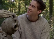 Kevin drinks the water from her vase..