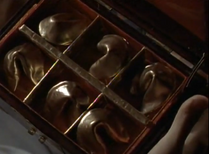 Inside the box, it holds Golden Fortune Cookies!, and David realizes they are worth a lot of money!