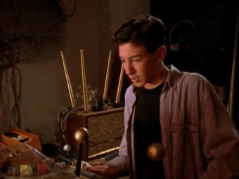 Ross plays pinball on the new machine