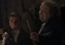 They have caught up with him and are ready to nail him! They don't believe when he tells them he's not a vampire