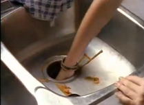 Sharon, realizes Janice was right and saves Janice from the garbage disposal