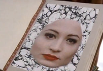 Madame Visage sends her face to store inside the book!