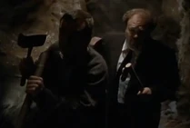 Stanley and Carl are nervously following him armed with their hammers and stakes!