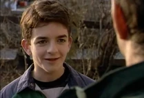 The next morning, his parents are stunned to see him dress like a normal teenager and wants to leave and go to a football game instead