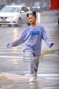 Ariana and friends under the rain in NY September 18 (8)