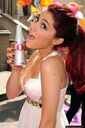 Ariana posing with a "col" bottle