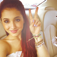 Ariana showing the peace sign