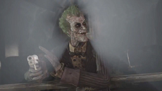 Joker revealing himself to Batman at the Monarch Theatre after he shot and killed Talia