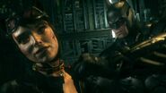 Batman unlocks Catwoman's explosive collar.