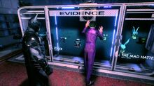 Joker staring at his former equipment on display in the Evidence Room at the GCPD Lockup.
