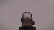 Alternate variant attached to the top rail of the DMS. Note the red chevron reticle instead of the standard red dot.