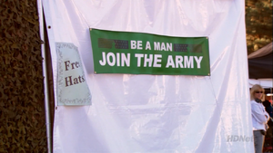 The state's "Be a Man. Join the Army" banner, at the Church and State Fair ("Notapusy")