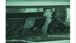 G.O.B. holding a picture of Michael runs a red light. ("Righteous Brothers")