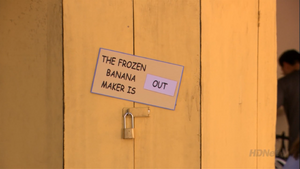 The banana stand displays a "the frozen banana maker is out" sign similar to Lucy's "the doctor is out" sign on her psychiatric help stand ("Good Grief") ("Out on a Limb")