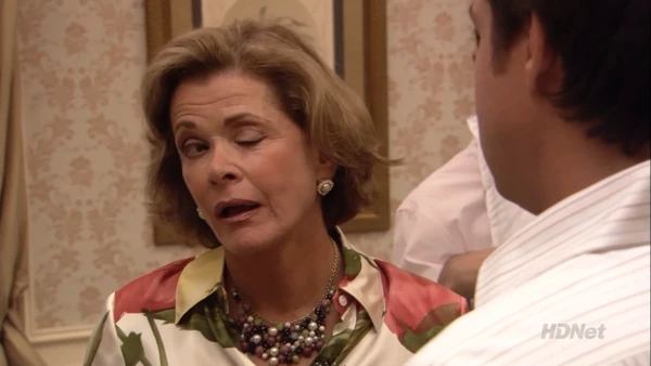 Lucille winks at Michael