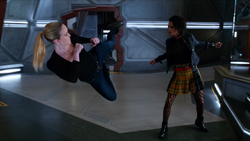 Charlie and Sara fighting.