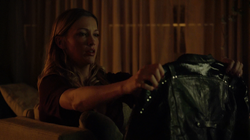 Laurel looks at Sara's jacket