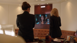 Cat Grant and President Marsdin speak with Rhea