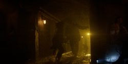 Batwoman confronts Killer Croc.