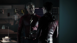 Jay gives Barry his helmet after deciding to stay in the Speed Force.