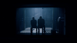 Barry and Diggle in Deathstroke's cell