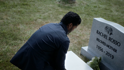 Ramsey in front of his mother's grave