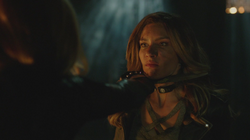 Dinah held at knife point by Black Siren