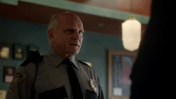 Eddie talking with Officer .