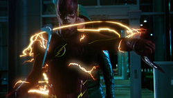 The Flash intercepting two boomerangs from striking the Arrow