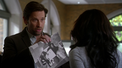 Mason showing an image of what occurred during the CC Jitters shooting to Iris