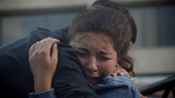 Ruby cries as she hugs her mother