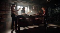 Dinah Laurel and Felicity go through files