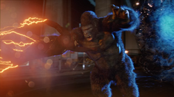 Flash empurrando Grodd por uma brecha