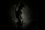 Oliver as the vigilante, The Hood.