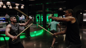 Rene and Diggle stick-fighting