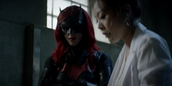 Batwoman brings Dodgson to Mary's clinic