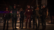Green Arrow, Flash, Black Canary, Spartan, Speedy, Hawkman and Hawkgirl facing Vandal Savage