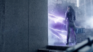 Accelerated Man emitting purple lightning