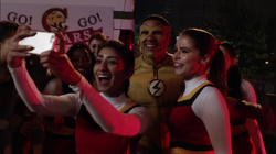 Kid Flash with cheerleaders