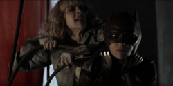 Alice strangles Batwoman