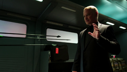 Damien Darhk stops the Green Arrow's arrows