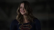 Supergirl while meeting Earth-1 heroes.png (800 KB) Kara Danvers in the third Supergirl suit.
