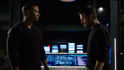 Diggle and Oliver argue and fight over their differences.