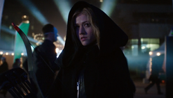 Mia Smoak in a black hood